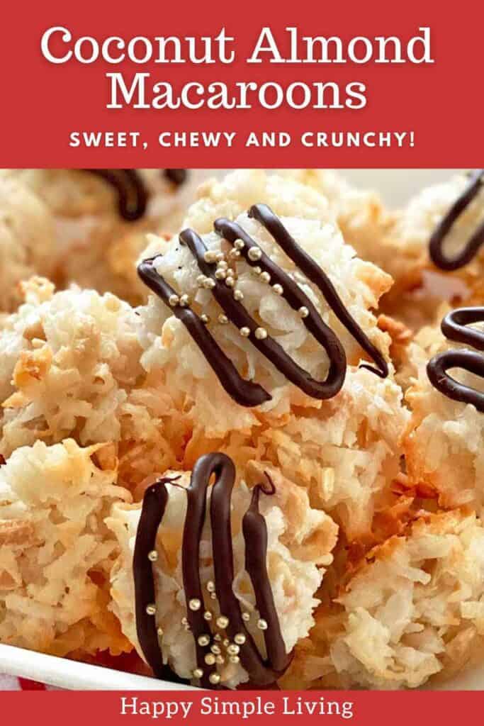 Close-up of coconut almond macaroons drizzled with chocolate and topped with silver sprinkles. The image has a red banner with white text at the top and bottom, reading Coconut Almond Macaroons and Happy Simple Living.