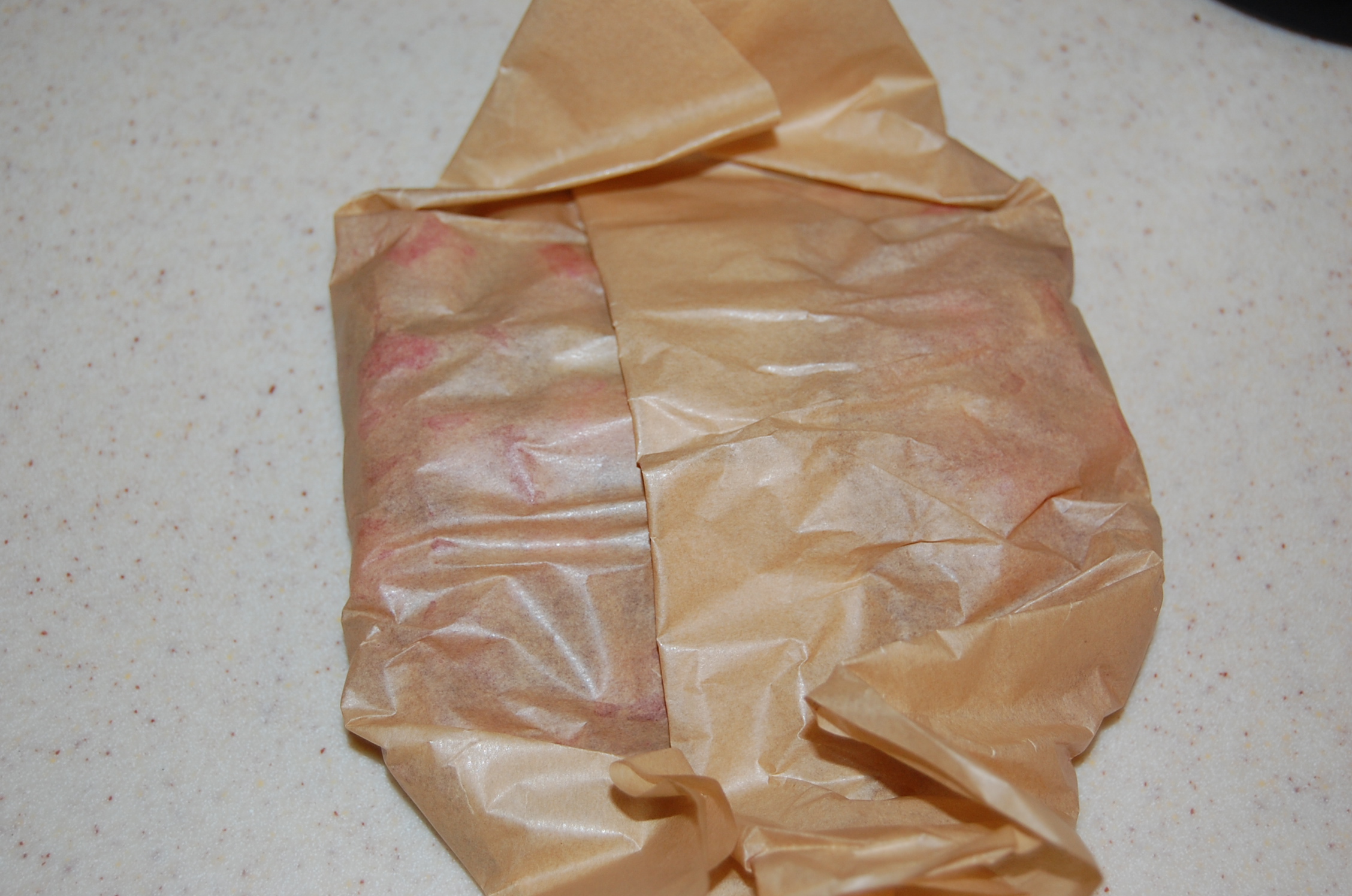 DSC_0011 Rhubarb wrapped in parchment paper in preparation for freezing.