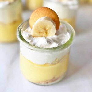 Close up of mini banana pudding cup in a small glass jar.