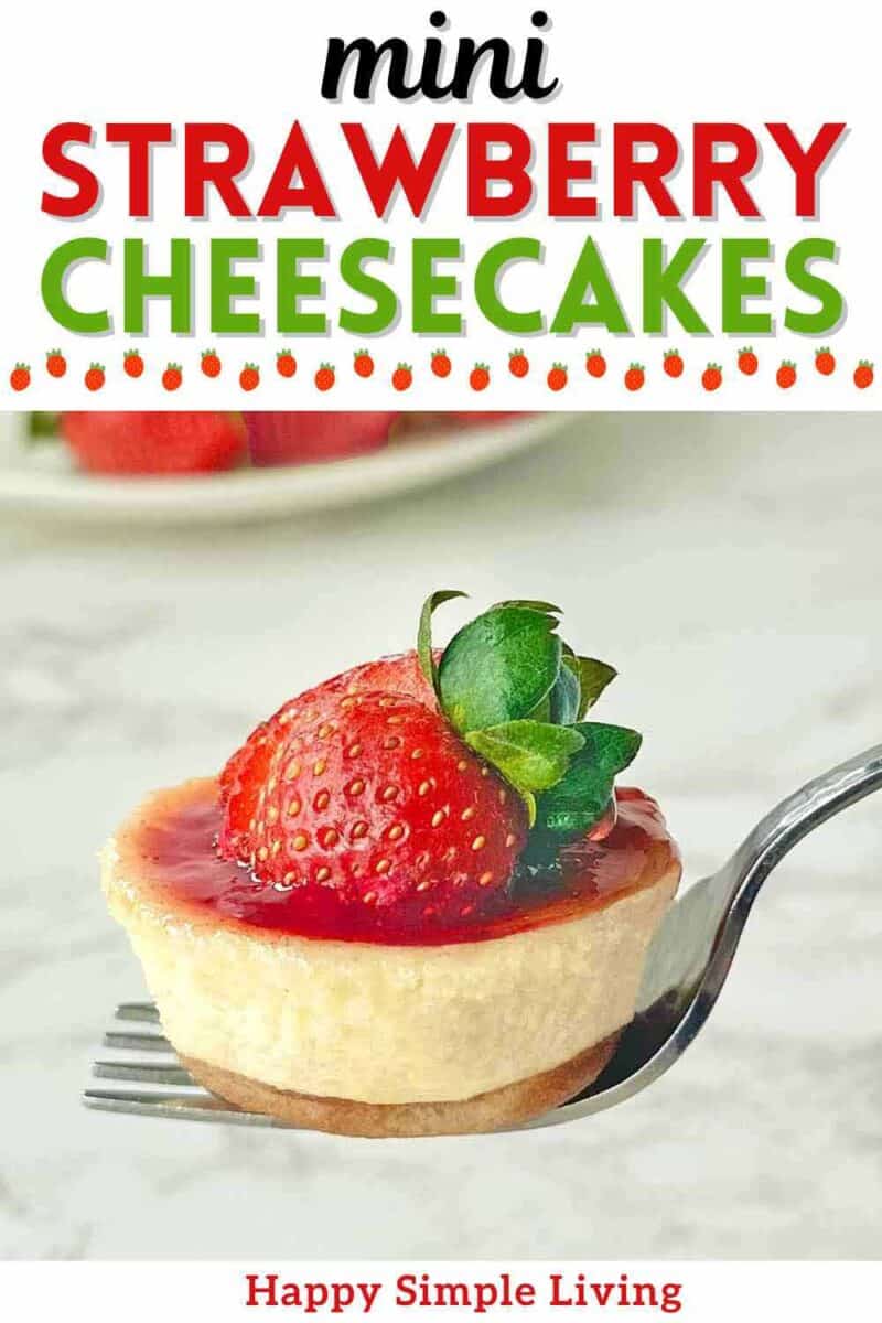 A mini strawberry cheesecake on a fork.
