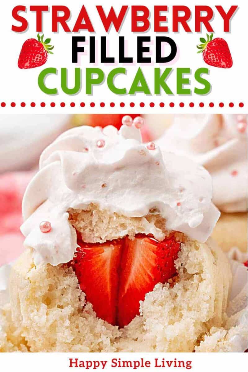 A strawberry filled cupcake showing the fresh strawberry inside.